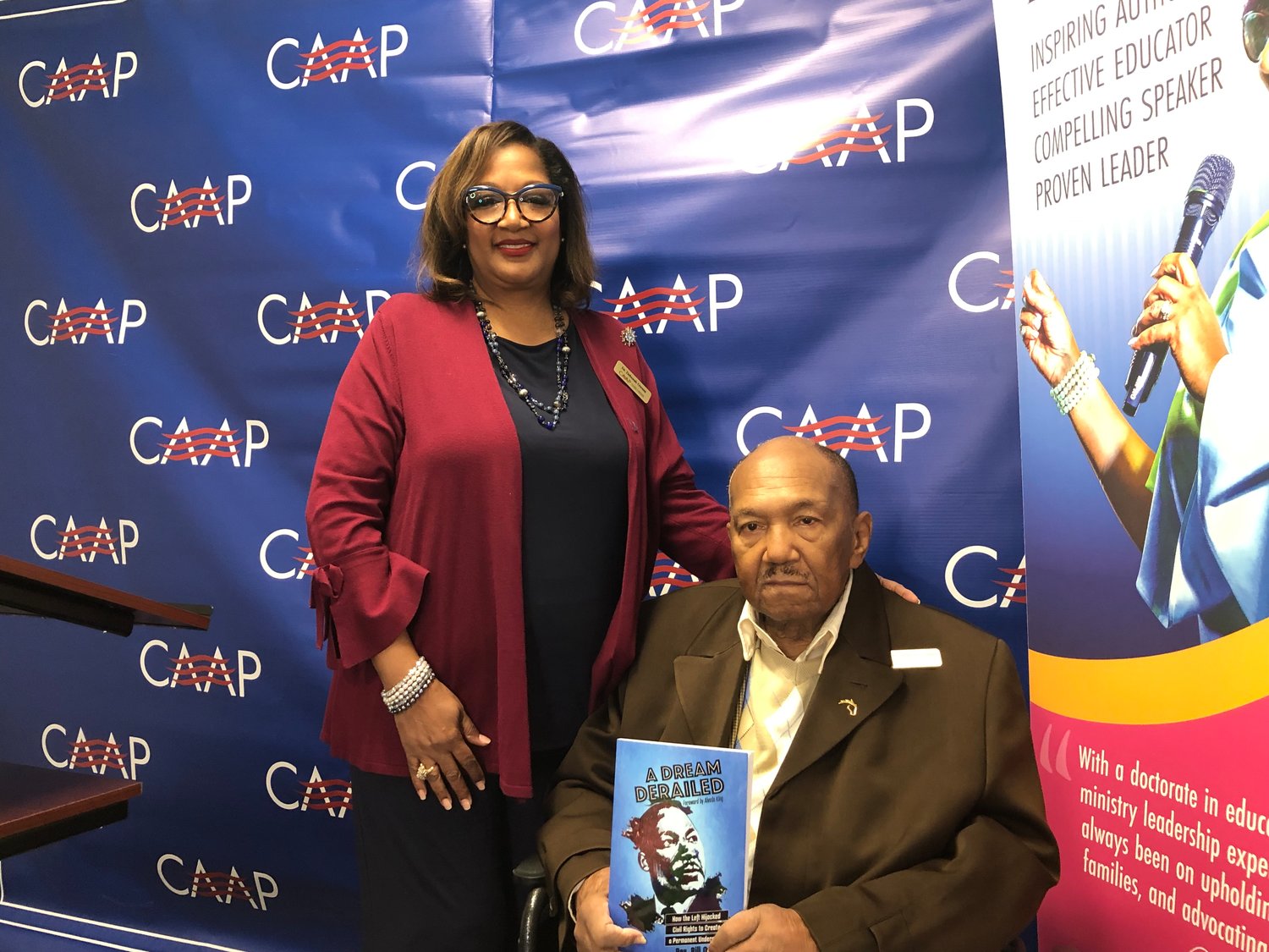 Deborah Owens and her husband, Rev. Bill Owens, pose with a copy of their 2019 book, "A Dream Derailed."